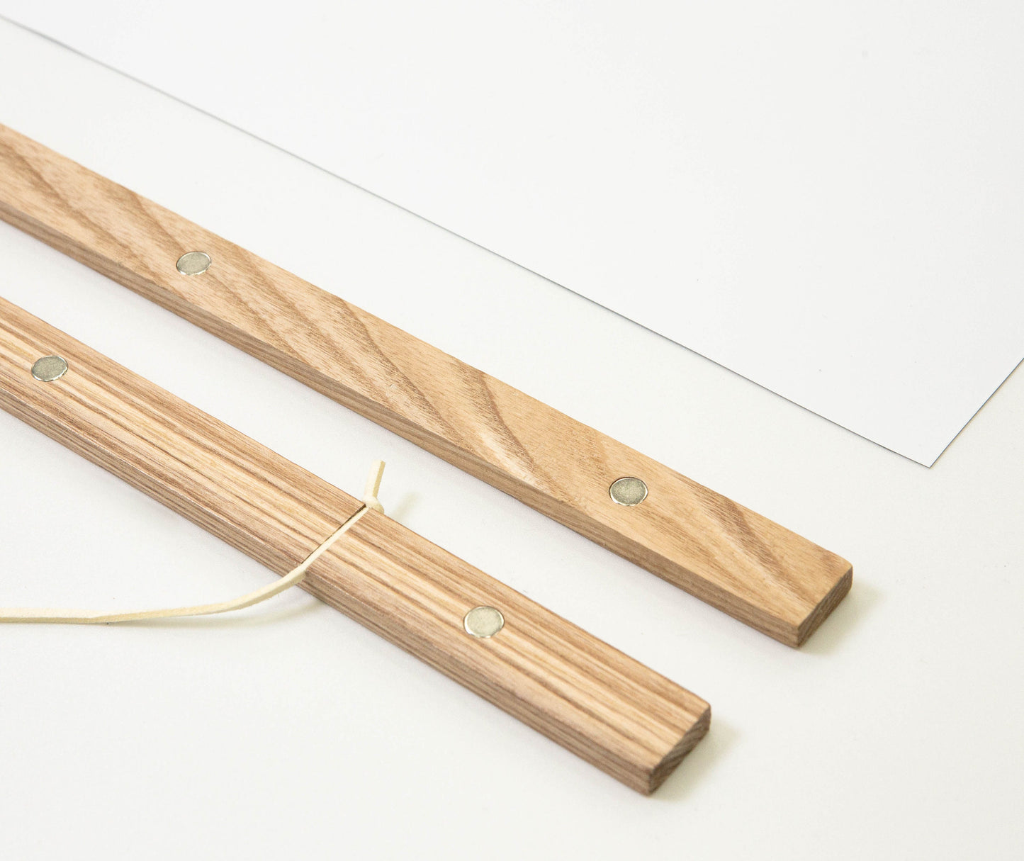 detailed picture of wooden snaps including magnet for hanging a poster