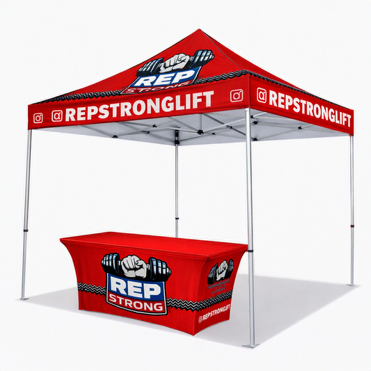 A red pop-up canopy tent with matching branded table cover, shown on a clean white studio background. The canopy and table are printed with the brand name REPSTRONGLIFT, a raised-fist barbell graphic, and social media icons.