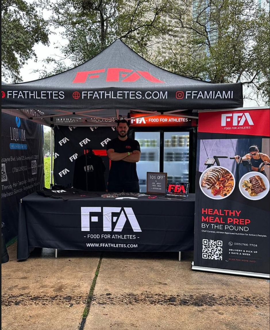 FFA (Food for Athletes) booth with branded tent and banner at an outdoor event.